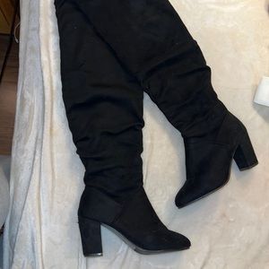Knee high heeled boots